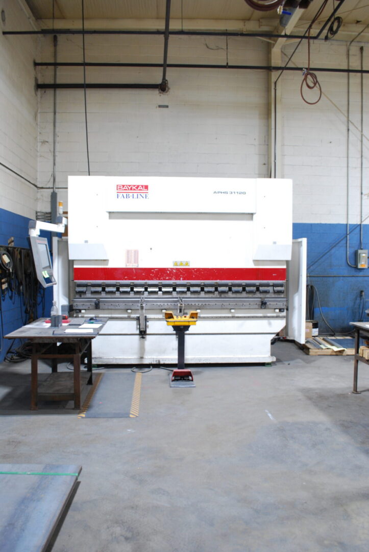 White industrial press brake machine in workshop