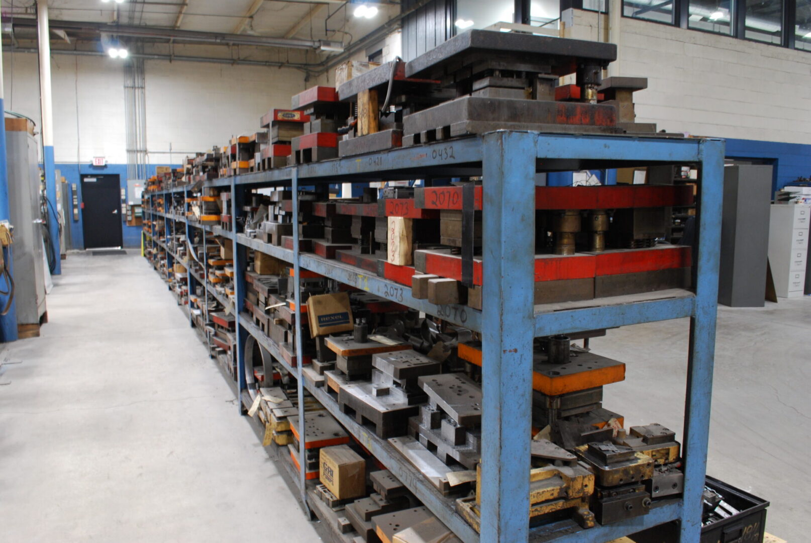 Industrial metal stamping dies on storage racks