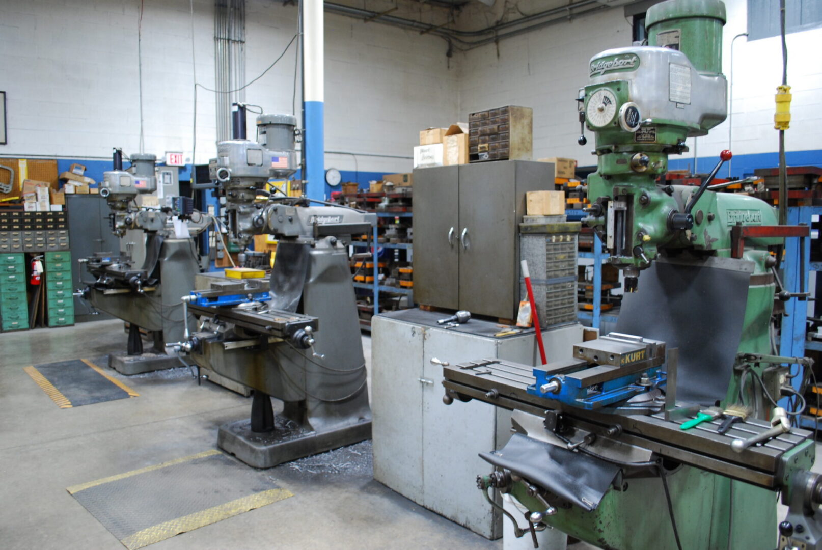 Row of metal milling machines in workshop