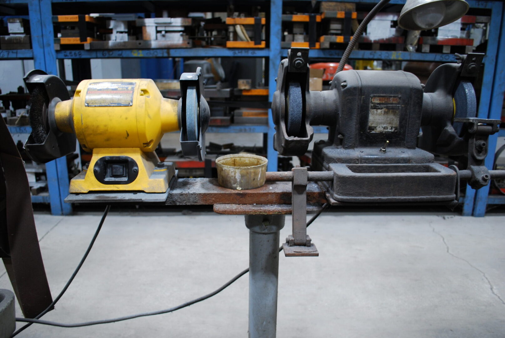 Two bench grinders on workshop bench
