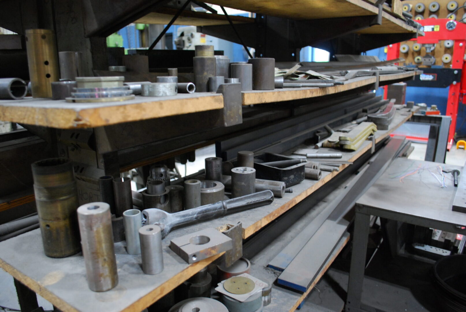 Industrial metal parts on workshop shelves