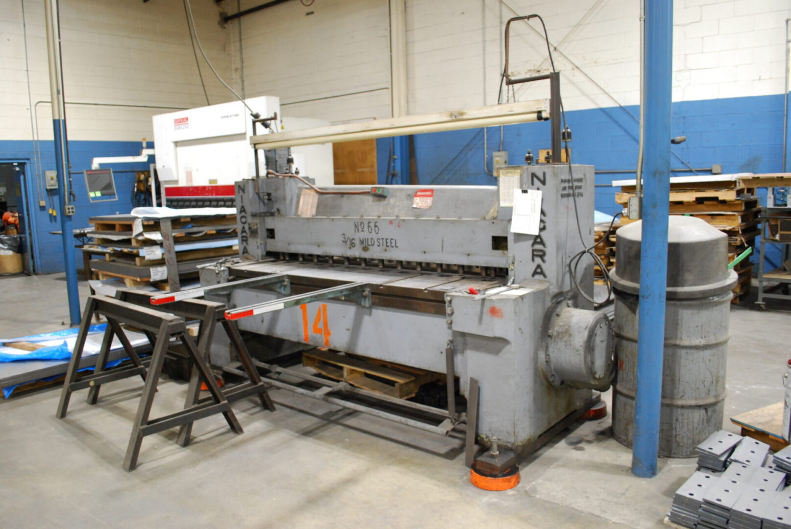 Industrial metal shearing machine in workshop