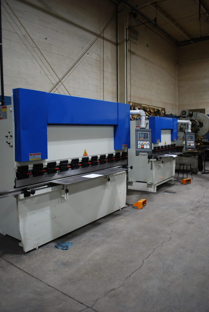Blue press brakes for sheet metal in workshop