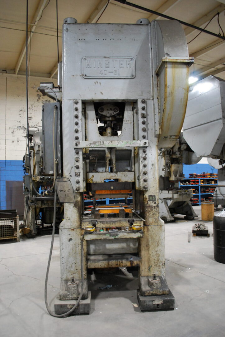 Large industrial metal stamping press in workshop